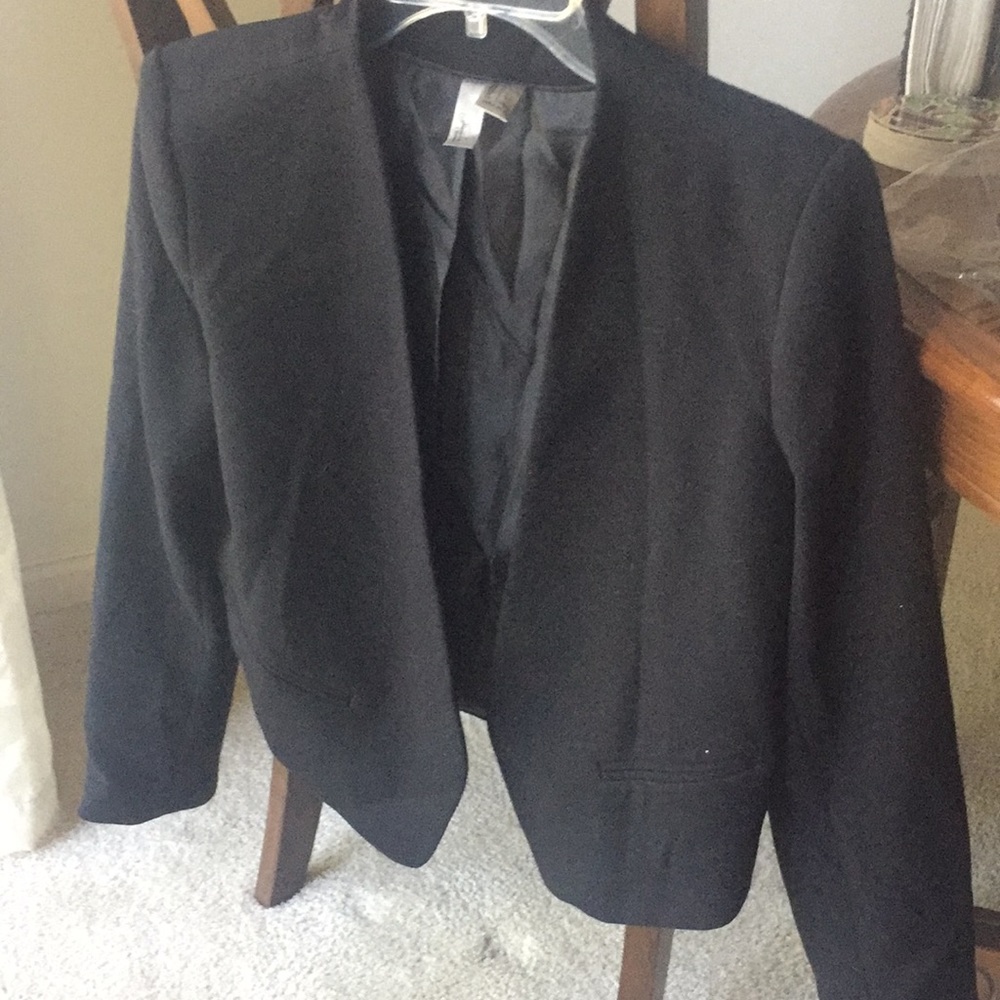 Black buttonless asymmetrical cut blazer